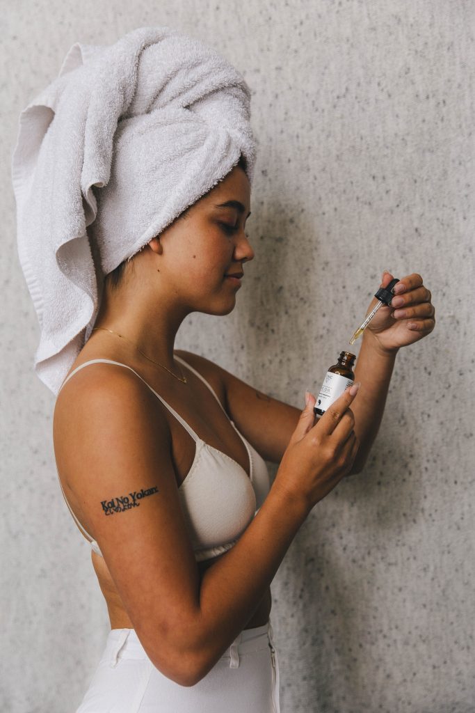 woman getting-ready taking cod-oil